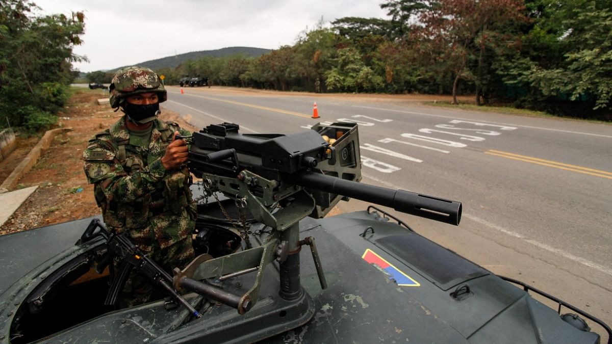 Soldiers stand guard at a check point in an avenue in Cucuta, near Venezuelan border, in Colombia. Credit: AFP photo
