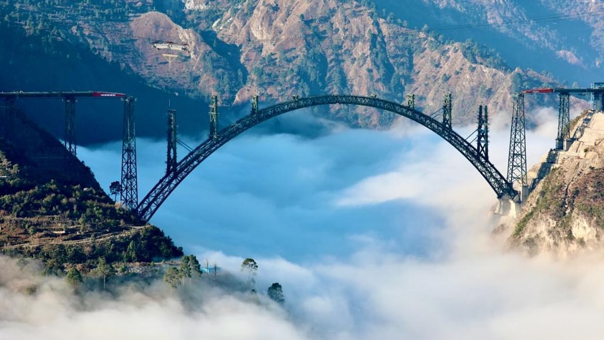 The bridge stands tall above the clouds and was one of the most difficult parts of the 111 km-long winding stretch from Katra to Banihal. Credit: Twitter/@RailMinIndia