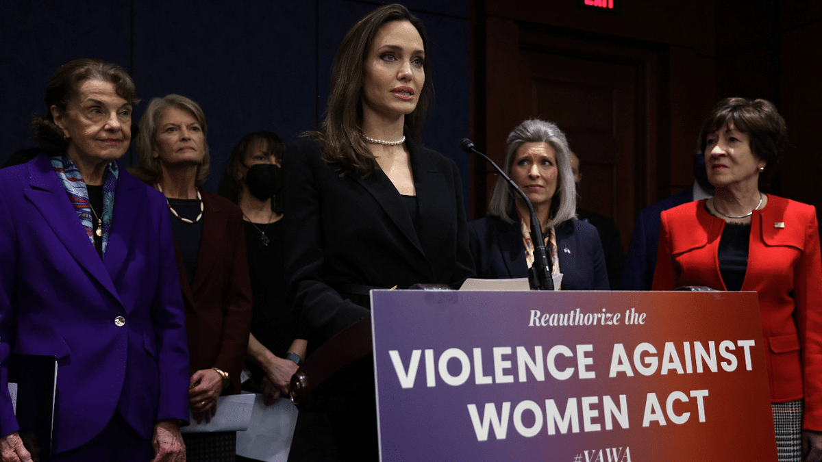 Actress Angelina Jolie speaks as (L-R) U.S. Sen. Dianne Feinstein (D-CA), Sen. Lisa Murkowski (R-AK), National Coalition Against Domestic Violence President Ruth Glenn, Sen. Joni Ernst (R-IA) and Sen. Susan Collins (R-ME) listen during a news conference at the U.S. Capitol February 9, 2022 in Washington, DC. A group of bipartisan U.S. senators held a news conference to announce a bipartisan modernized Violence Against Women Act (VAWA). Credit: AFP Photo