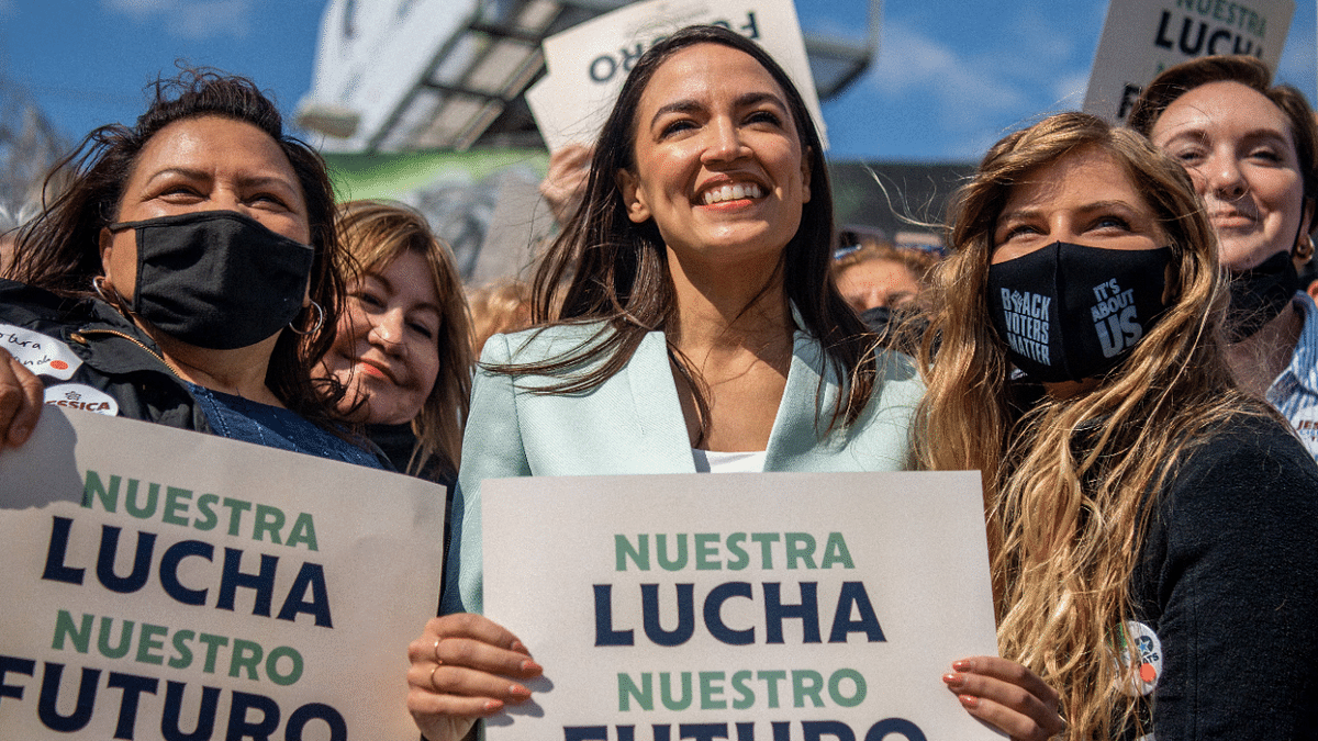 U.S. Rep. Alexandria Ocasio-Cortez (D-NY) poses for pictures with supporters duringthe 'Get Out the Vote' rally on February 12, 2022 in San Antonio, Texas. Credit: AFP Photo
