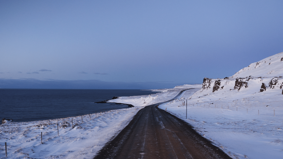 A road is pictured in front of Hunafloi bay during the winter near Hvammstangi, Iceland. Credit: Reuters Photo
