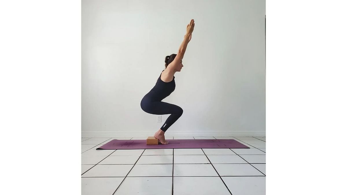 Utkatasana - This asana creates stability and strength in the shoulder joints. Apart from that, it also helps to strengthen the gluteus and quads. Credit: Instagram/natalia_miami_yoga