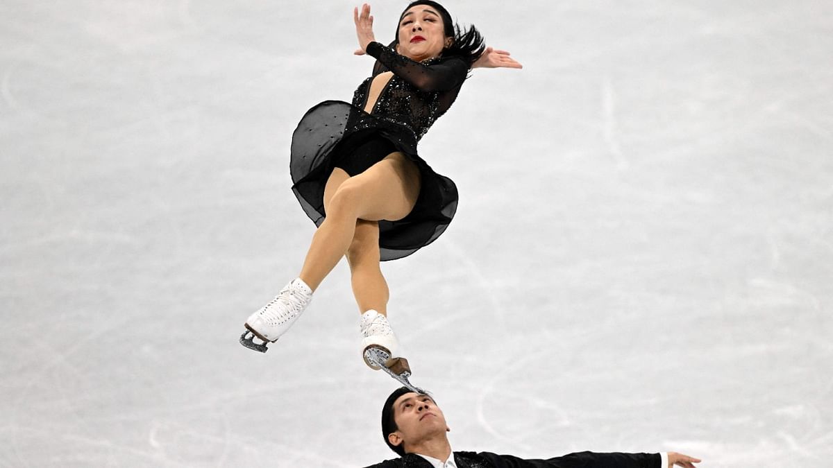 China's Sui Wenjing and China's Han Cong compete in the pair skating short program of the figure skating event during the Beijing 2022 Winter Olympic Games. Credit: AFP Photo