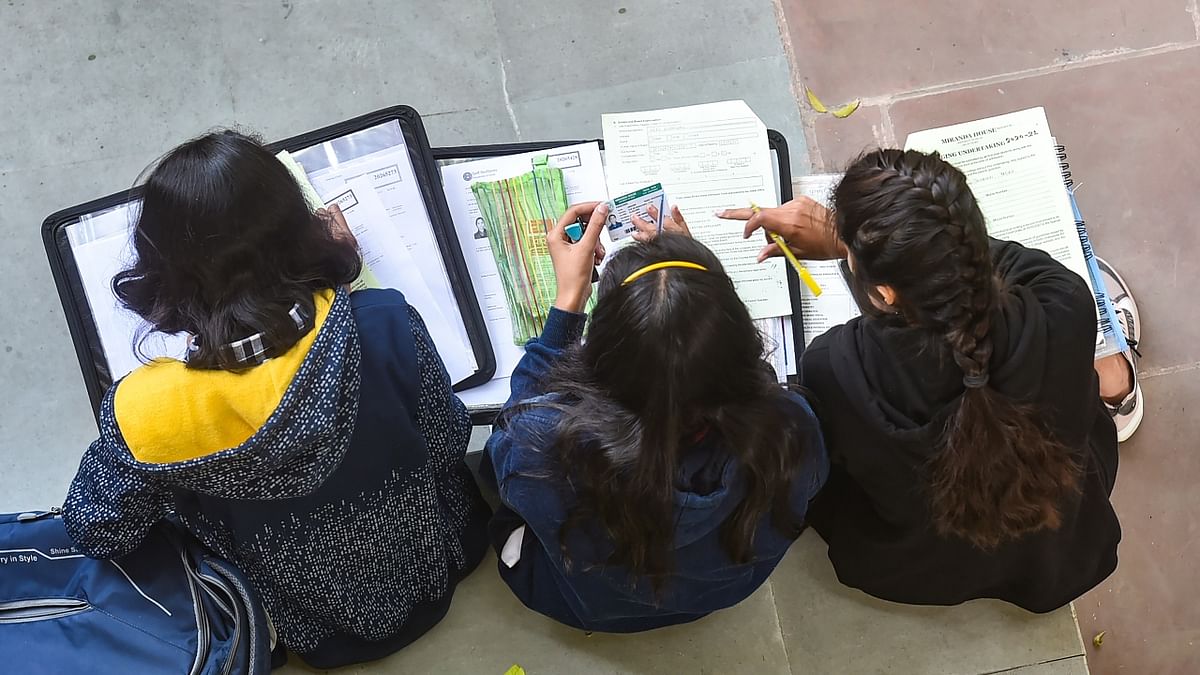 Students are seen taking notes at the Miranda House College, in New Delhi. Credit: PTI Photo