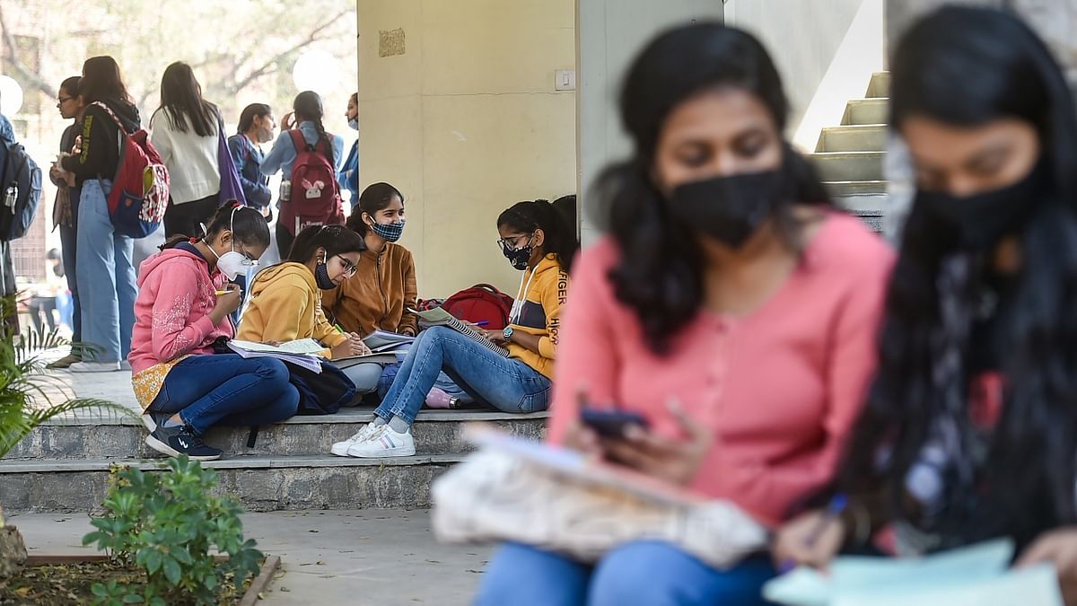 The Delhi University campus came alive on February 17 as students returned to colleges after a gap of almost two years. Credit: PTI Photo