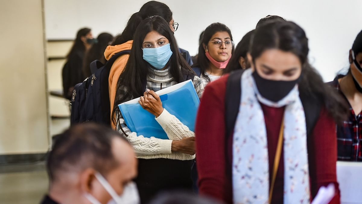 Students attend a class as the Delhi University colleges have reopened for classes, in New Delhi. Credit: PTI Photo