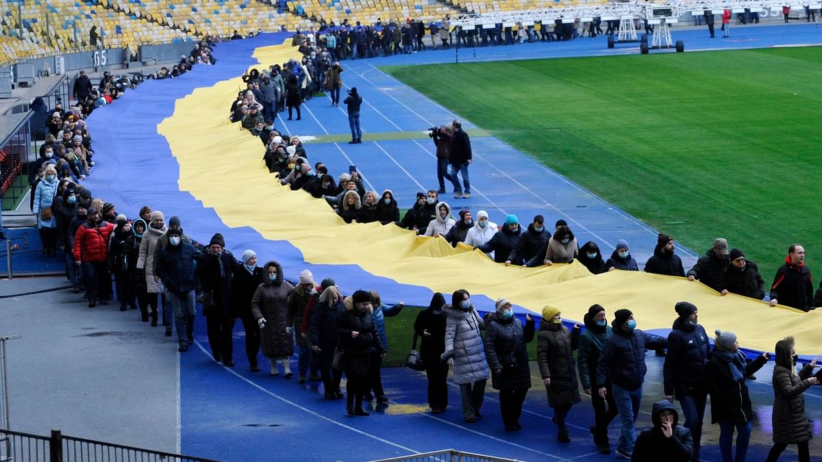 Ukrainian enthusiasts unfolded a 200-metre-long national flag at the Olympic stadium in Kyiv as part of the celebrations. Credit: AFP Photo