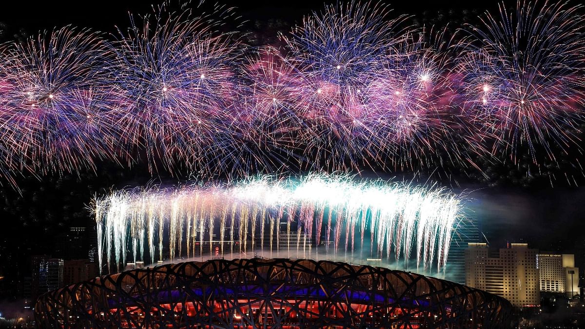 Fireworks illuminate the night sky during the closing ceremony of the Beijing 2022 Winter Olympic Games at the National Stadium in Beijing. Credit: AFP Photo