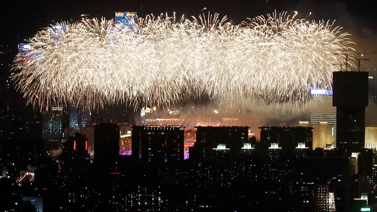 A general view of the city as fireworks explode over the National Stadium, also known as the Bird's Nest, at the end of the closing ceremony of the Beijing 2022 Winter Olympics, in Beijing, China. Credit: Reuters Photo