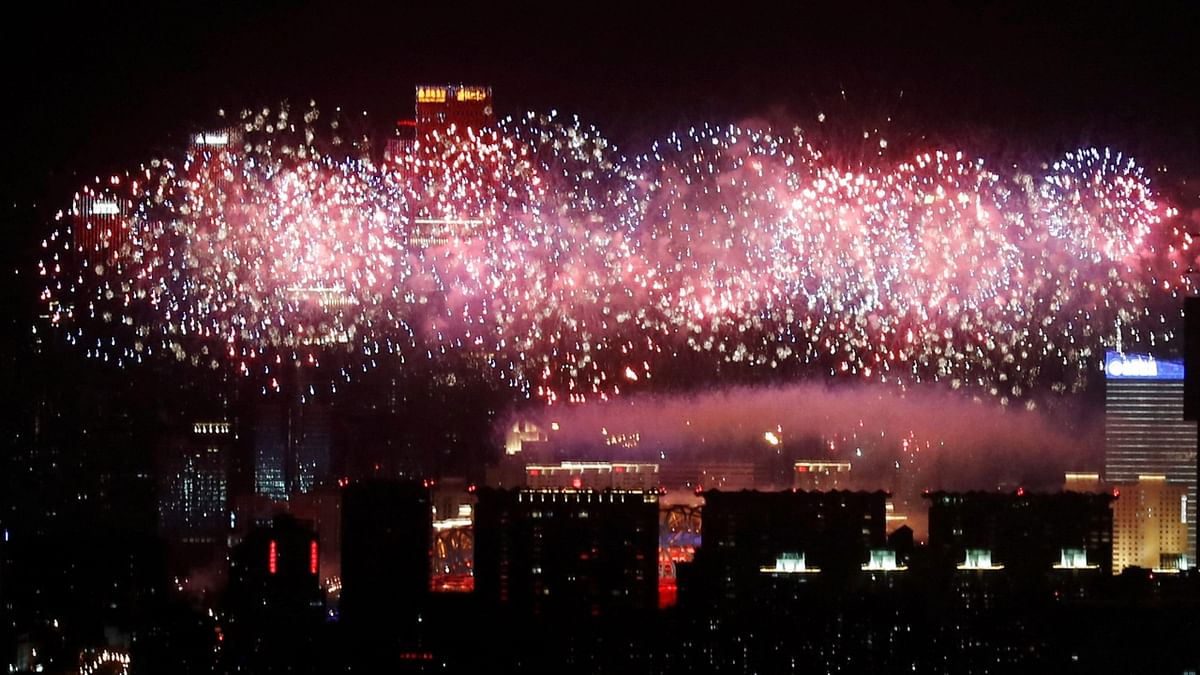 A general view of the city as fireworks explode over the National Stadium at the end of the closing ceremony of the Beijing 2022 Winter Olympics, in Beijing. Credit: Reuters Photo