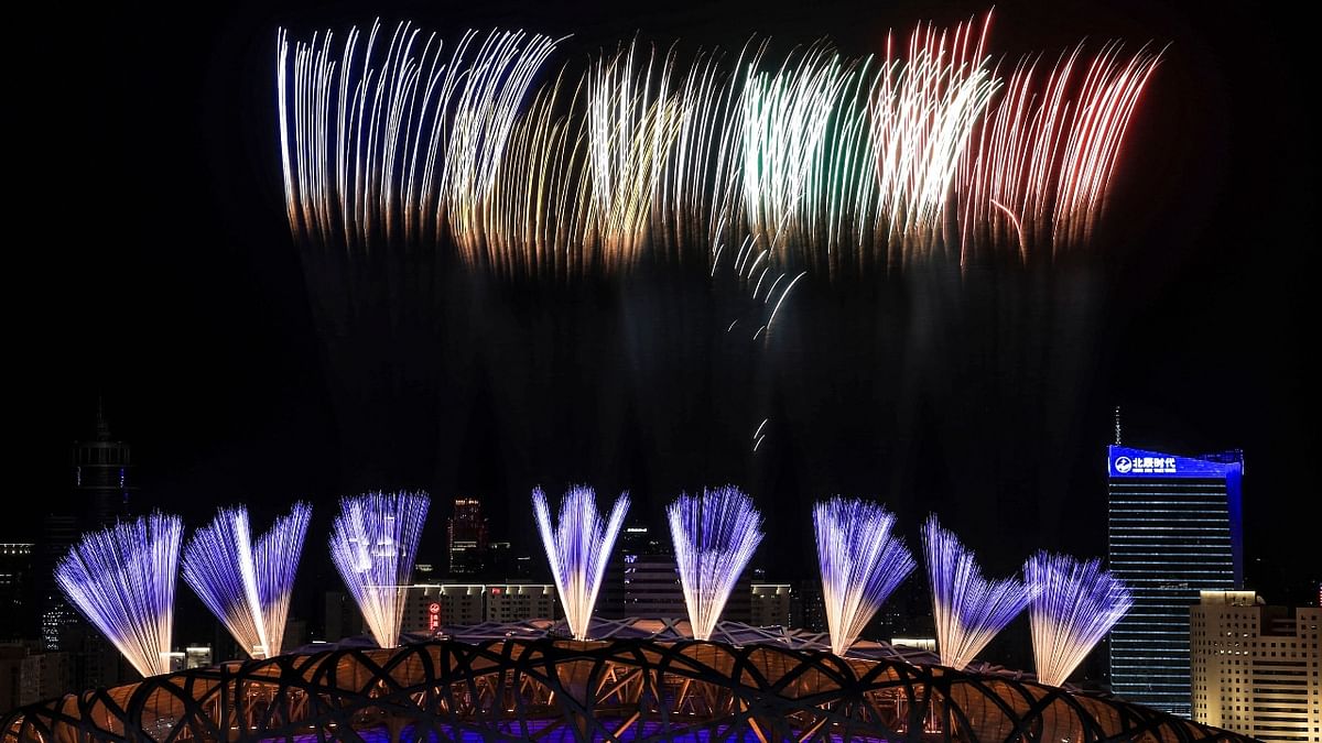 Fireworks illuminate the night sky during the closing ceremony of the Beijing 2022 Winter Olympic Games, at the National Stadium in Beijing. Credit: AFP Photo