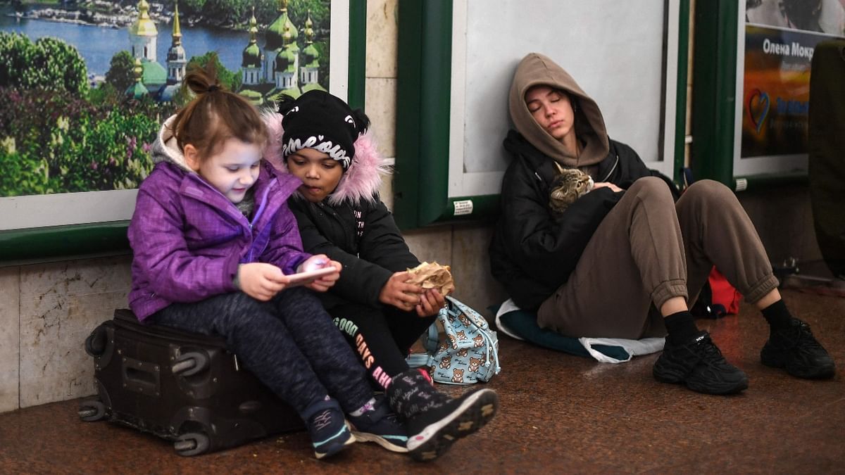 A family take shelter in a station in central Kyiv after Russia invades Ukraine. Credit: AFP Photo