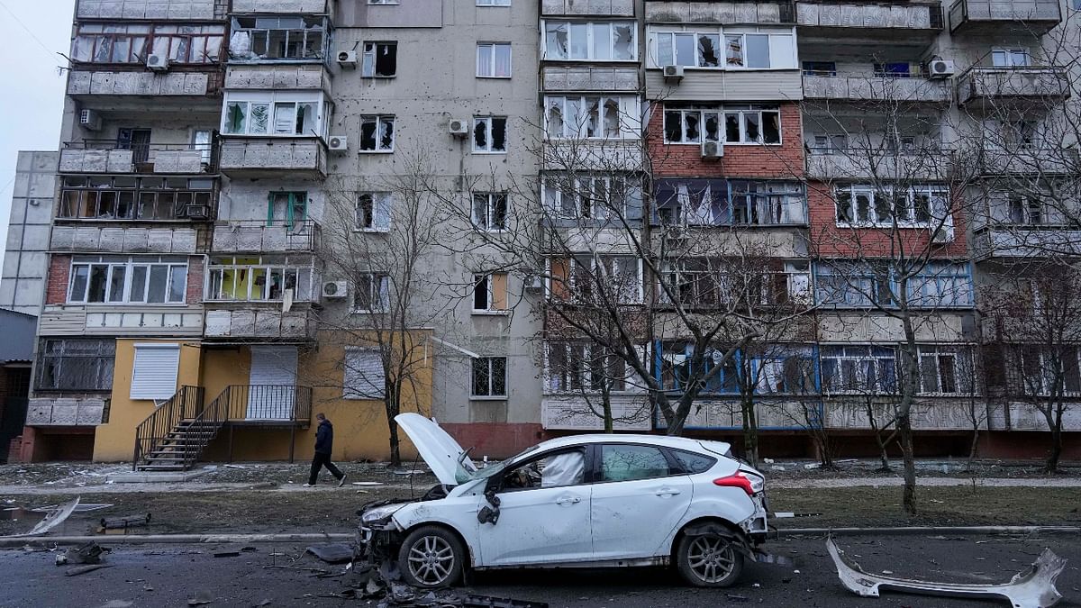 A view of a damaged car in the aftermath of Russian shelling, parked in a street in Mariupol, Ukraine. Credit: AP Photo