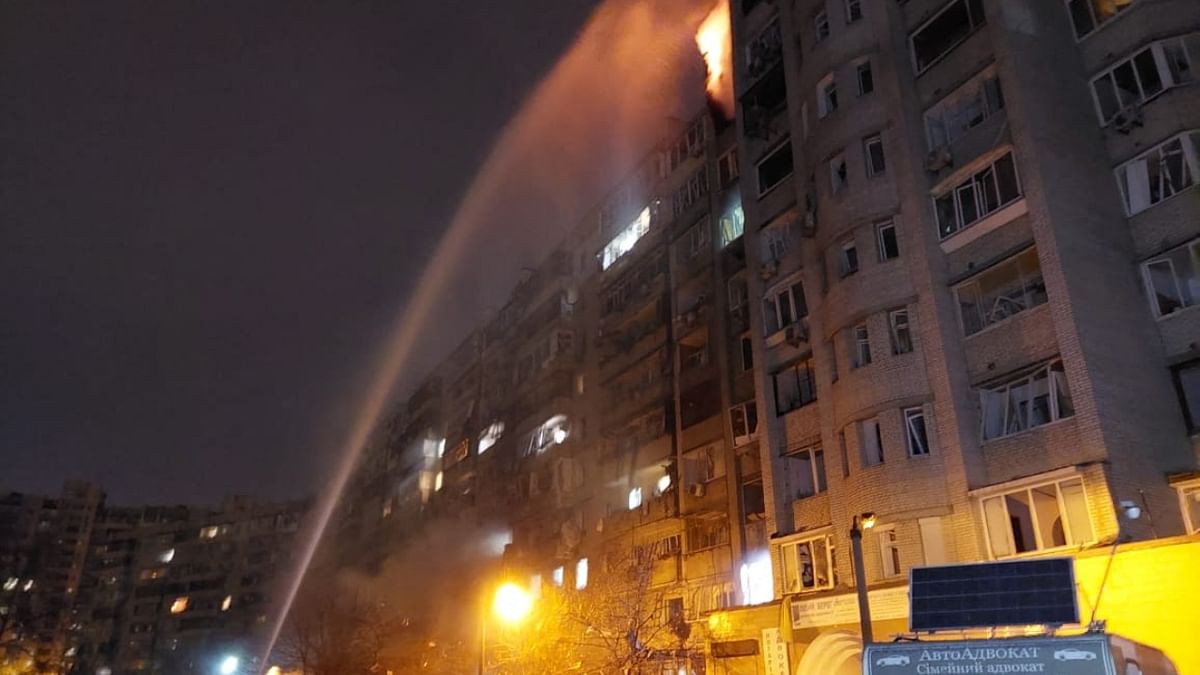 Firefighters extinguish a blaze at a damaged residential building at Koshytsa Street, a suburb of the Ukrainian capital Kyiv. Credit: AFP Photo