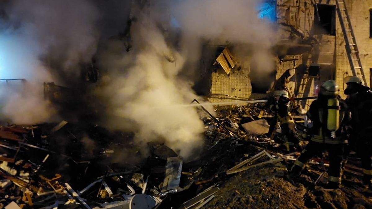 Firefighters extinguish a blaze at a damaged residential building at Koshytsa Street, a suburb of the Ukrainian capital Kyiv. Credit: AFP Photo