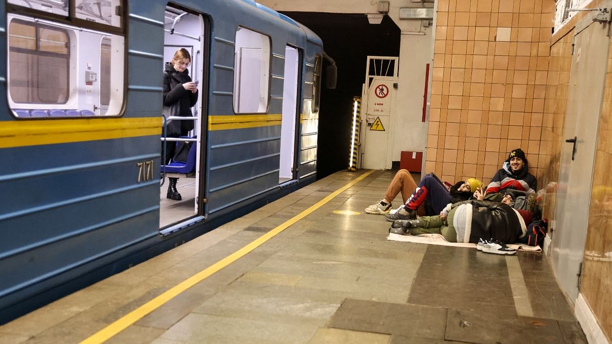 Ukrainians gather at a metro station as they seek shelter from expected Russian airstrikes in Kyiv. Credit: Reuters Photo