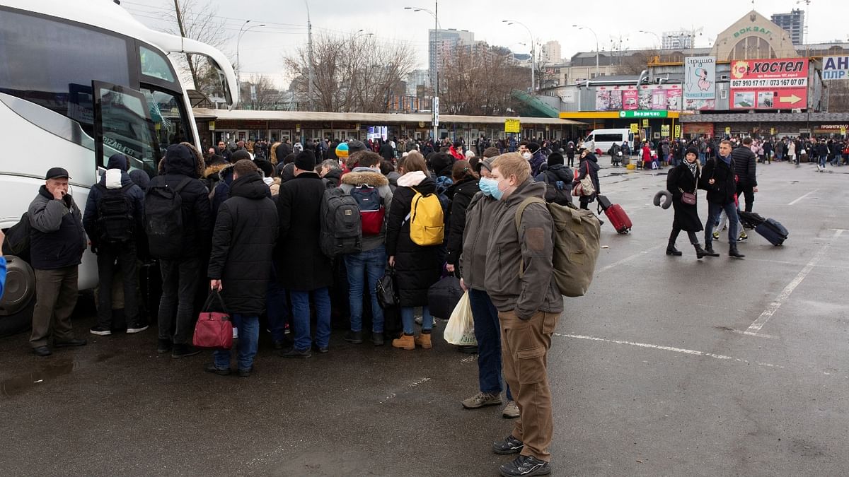 People gather at a bus station as they try to leave the city of Kyiv, Ukraine. Credit: Reuters Photo