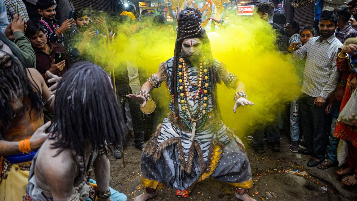 A devotee dressed as Lord Shiva performs during a religious procession ahead of the Maha Shivratri in Jalandhar. Credit: PTI Photo