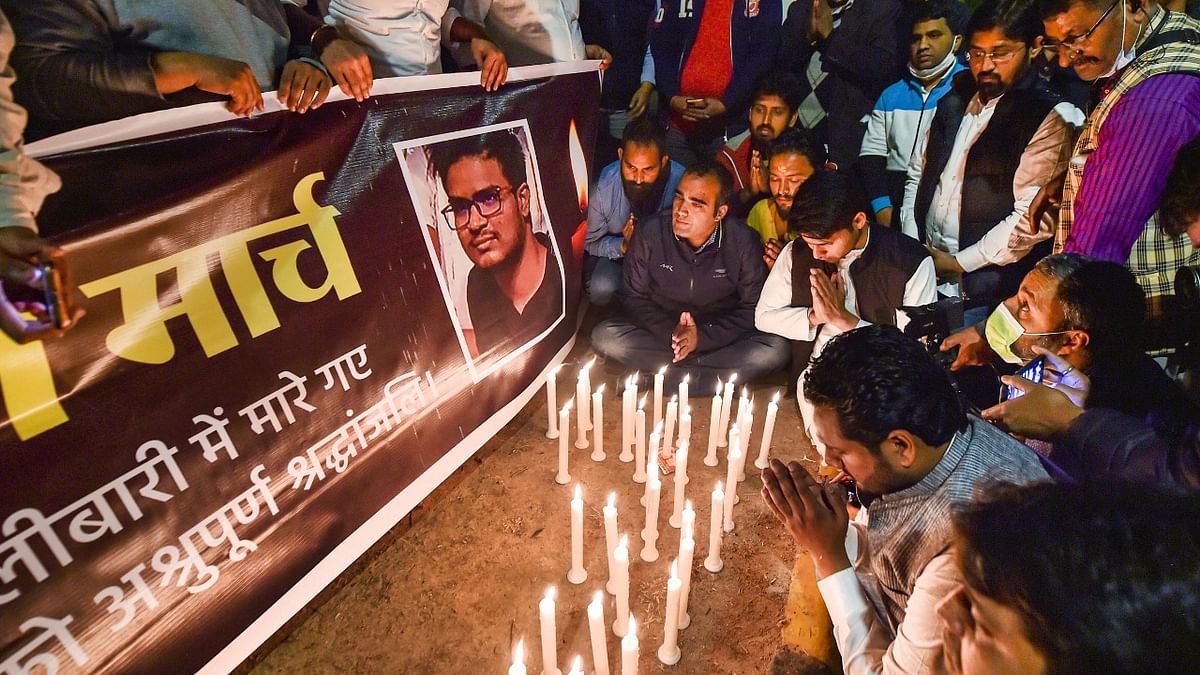 Members of Indian Youth Congress light candles to pay homage to Naveen Shekharappa, an Indian medical student who died due to Russian shelling in Ukraine's Kharkiv, in New Delhi. Credit: PTI Photo