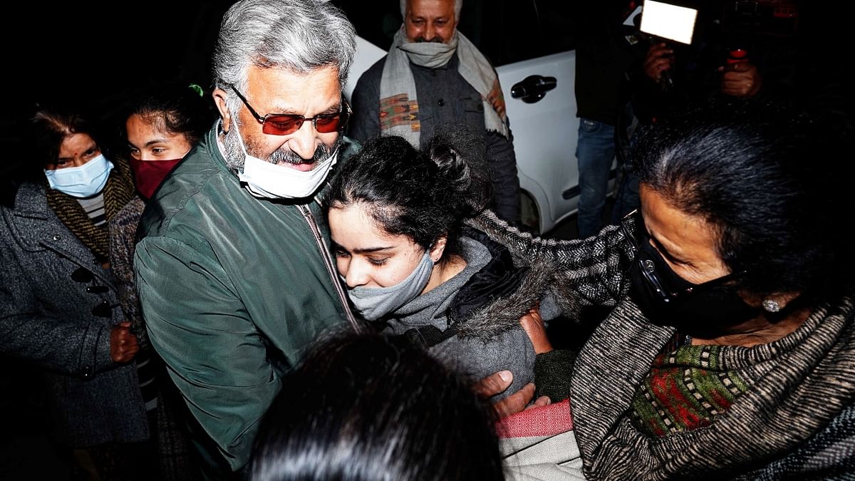 A student hugs her family members on her arrival in Shimla. Credit: PTI Photo