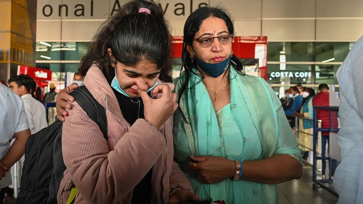 The evacuees reunited with their families at the airport after days of anguish and fear. Credit: AFP Photo