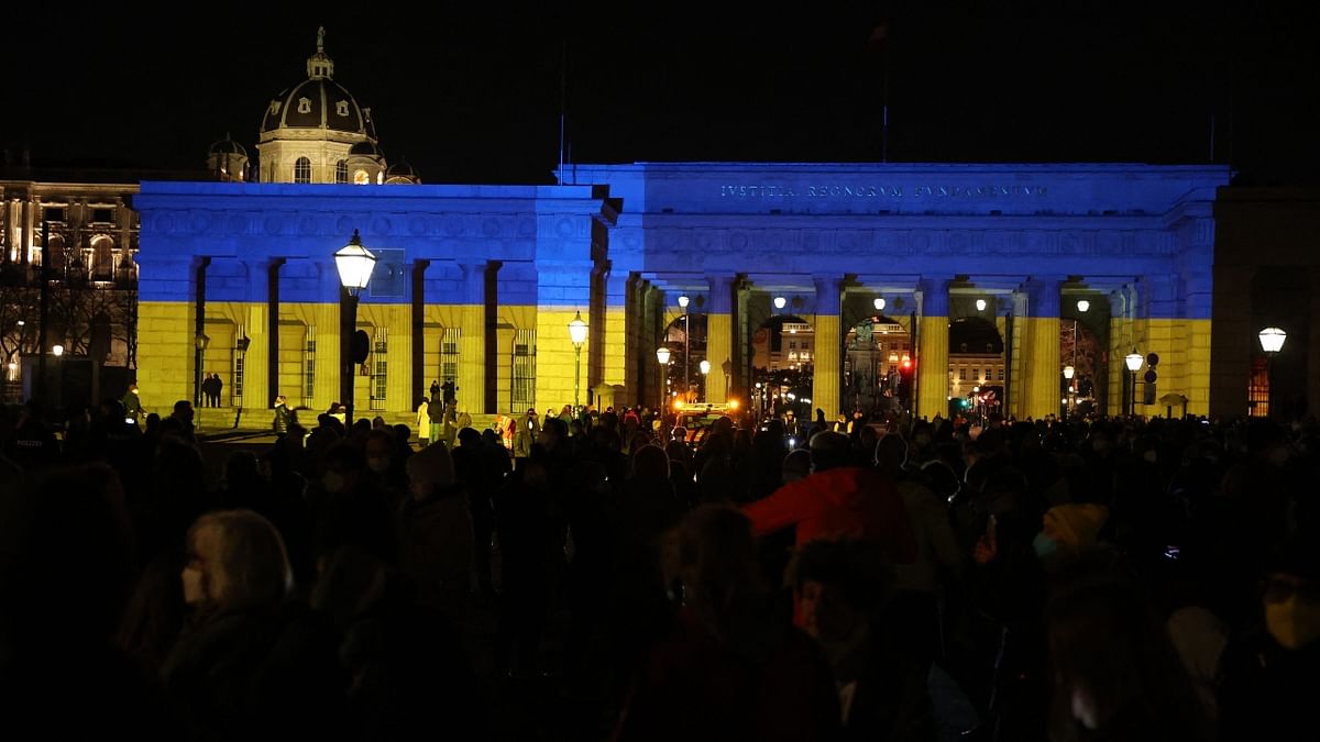 The Heldenplatz in Vienna is lit up with the colours of the Ukrainian flag. Credit: AFP Photo