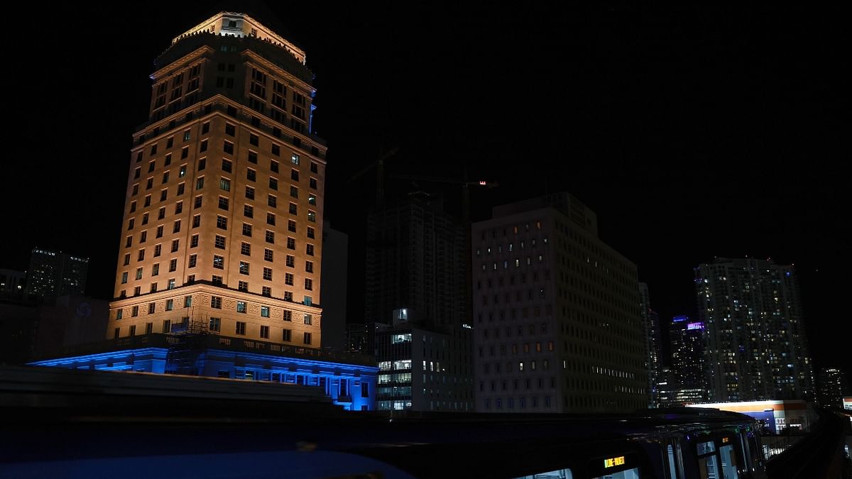 The Miami-Dade courthouse is lit in blue and yellow lights in a show of solidarity with Ukraine. Credit: AFP Photo