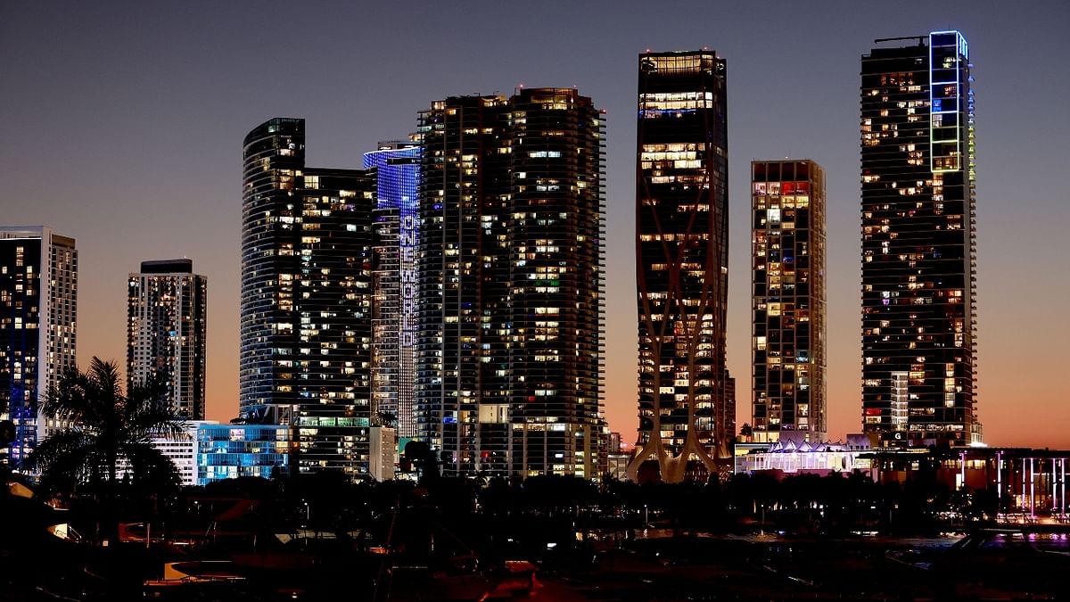 Blue and yellow lights are seen on some of the skyline buildings in a show of solidarity with Ukraine in Miami, USA. Credit: AFP