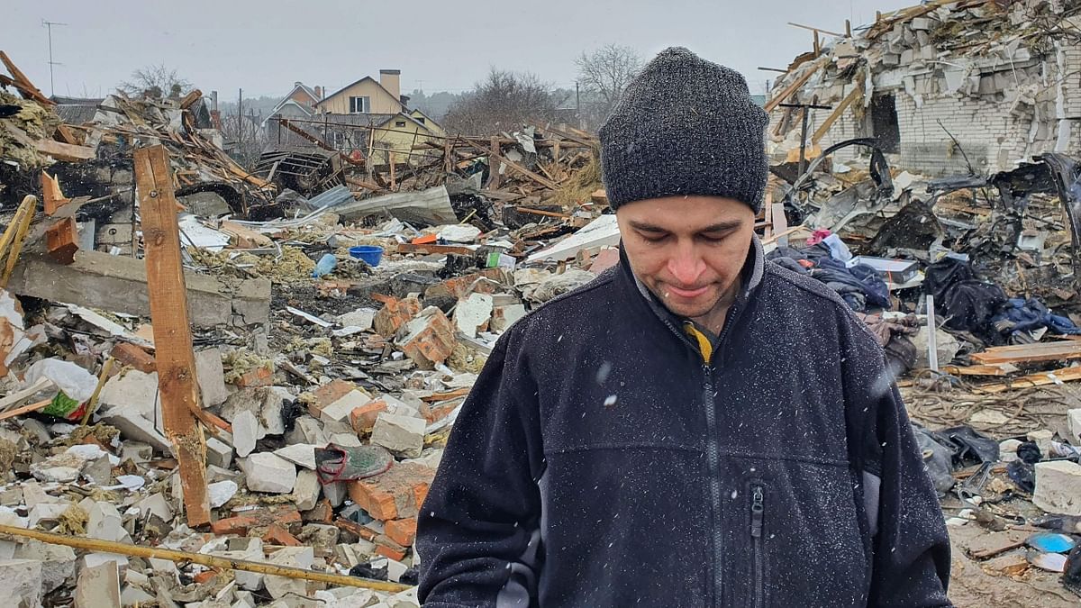 A local, who lost his wife Katia in the shelling, stands on the rubble of his house in Zhytomyr after it was destroyed by a Russian bombing. Credit: AFP Photo