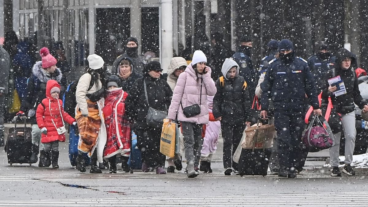 Braving snow and sub-freezing temperatures, thousands of refugees continued to flee Ukraine into neighbouring Romania through the Siret border crossing. Credit: AFP Photo