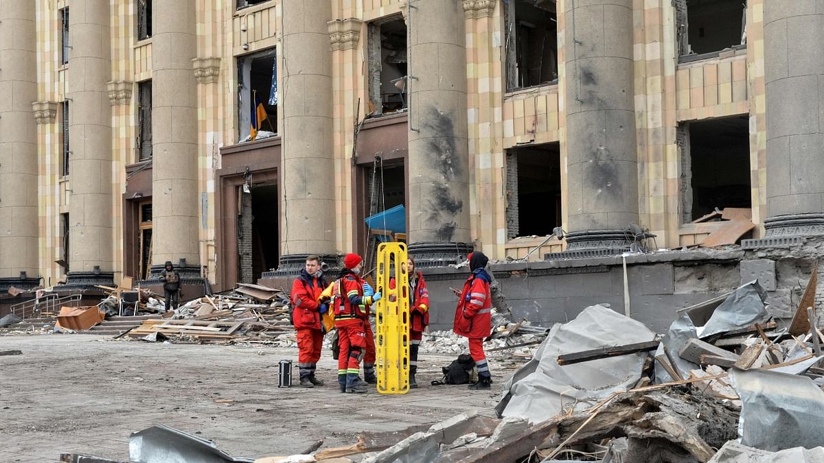 Medics stand outside the damaged local city hall of Kharkiv. Credit: AFP Photo