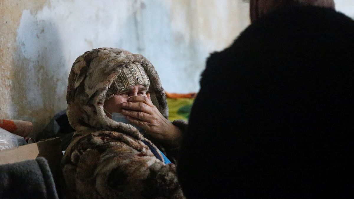 A local resident weeps to the sound of shell explosions in a bomb shelter in Mykolaivka (Nikolaevka) in the Donetsk region, Ukraine. Credit: Reuters Photo