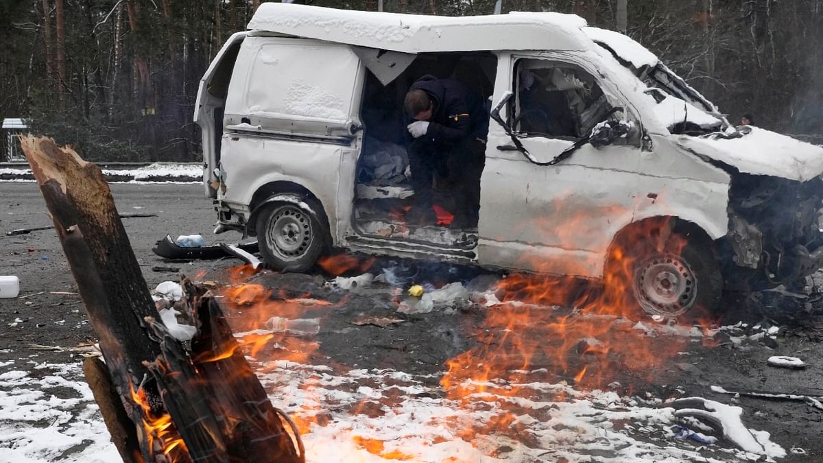 A man gets emotional as he sits inside a vehicle damaged by shelling, in Brovary, outside Kyiv, Ukraine. Credit: AP Photo