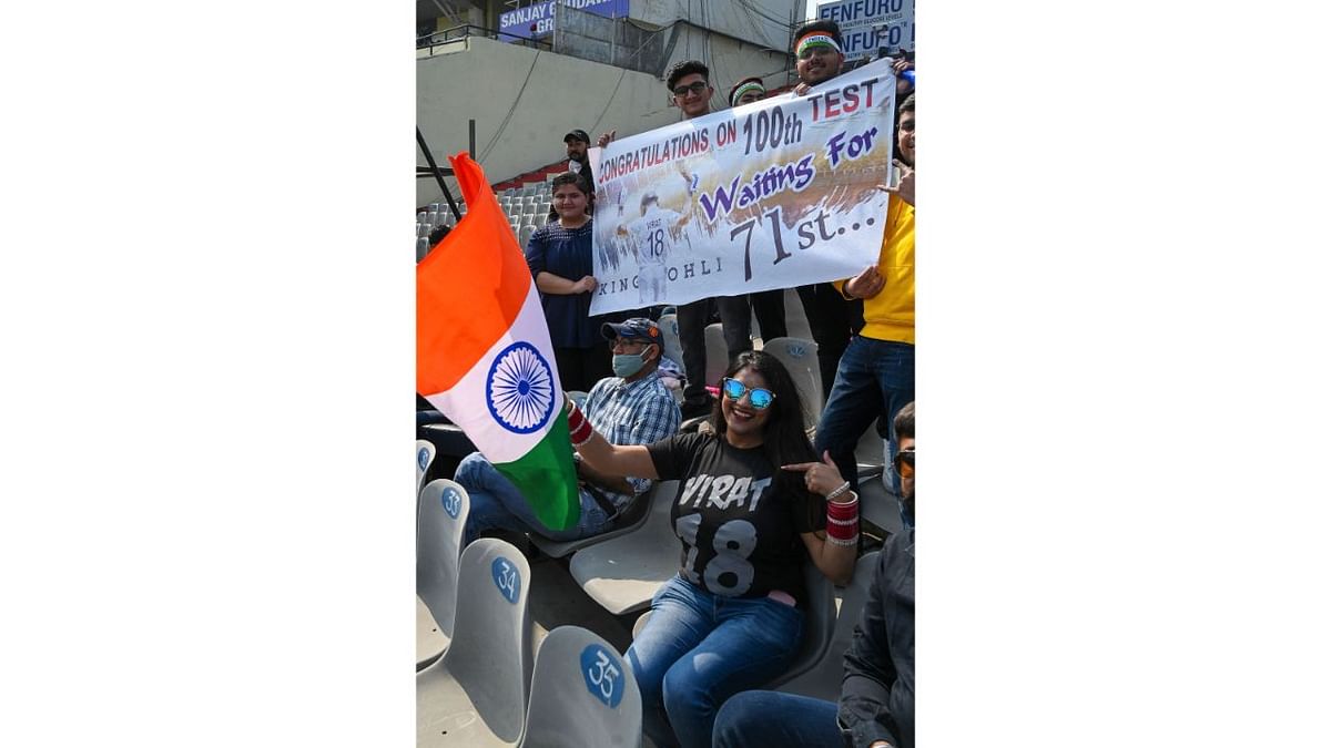 Kohli's fans cheer for their idol during the first Test cricket match between India and Sri Lanka at the Punjab Cricket Association Stadium in Mohali. Credit: AFP Photo