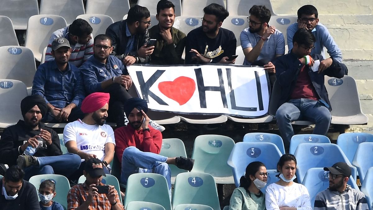 Kohli's fans watch the first-day play of the first Test cricket match between India and Sri Lanka. Credit: AFP Photo