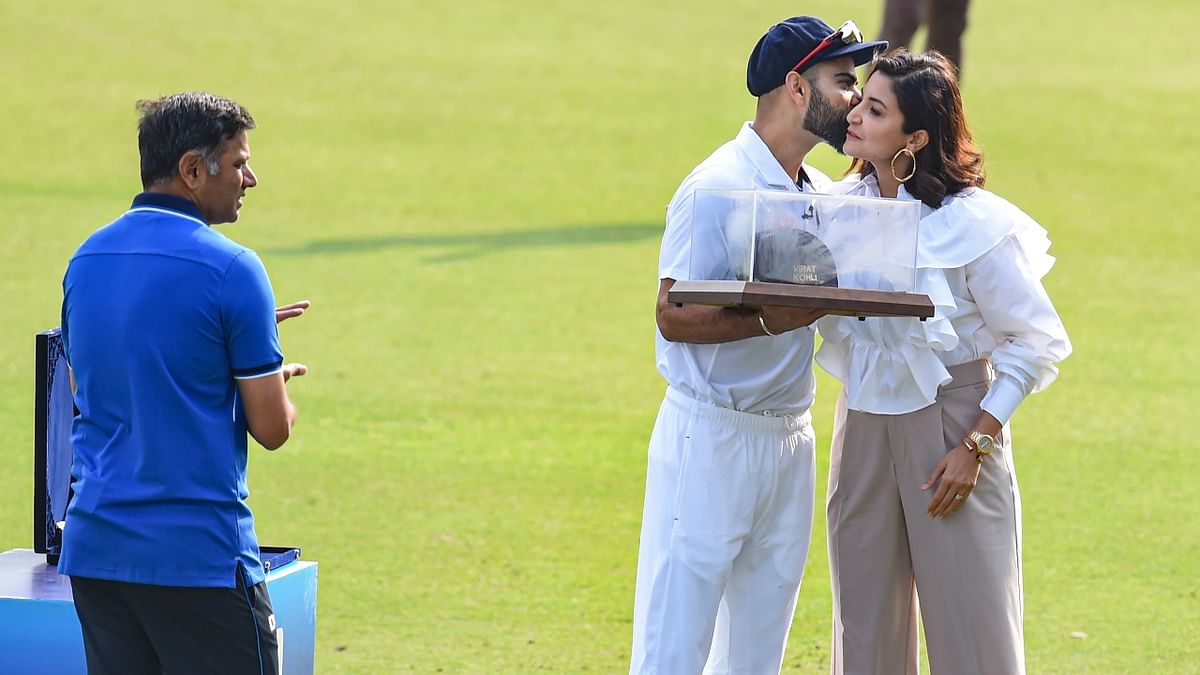 Virat was also felicitated by the home board before the start of play with batting great and current India coach Rahul Dravid handing him a commemorative cap and a memento in the presence of his wife Anushka Sharma. Credit: PTI Photo
