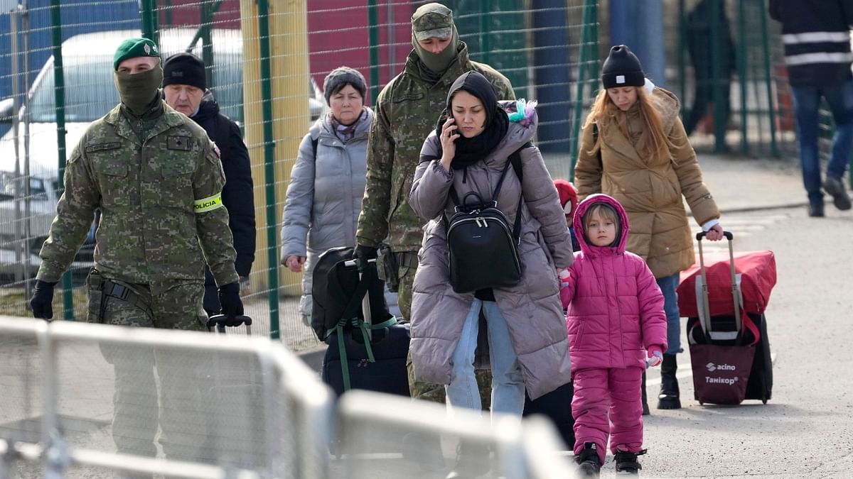 People flee from war-torn Ukraine and are seen on the border in Vysne Nemecke, Slovakia. Credit: AP Photo