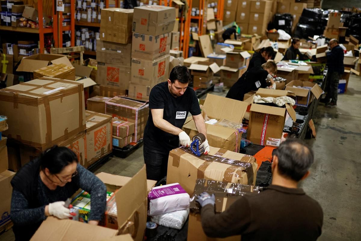 Employees and volunteers pack humanitarian aid donations to be shipped to Ukraine, following Russia's invasion of Ukraine, at Meest-America, Inc. warehouse in Port Reading, New Jersey. Credit: Reuters Photo
