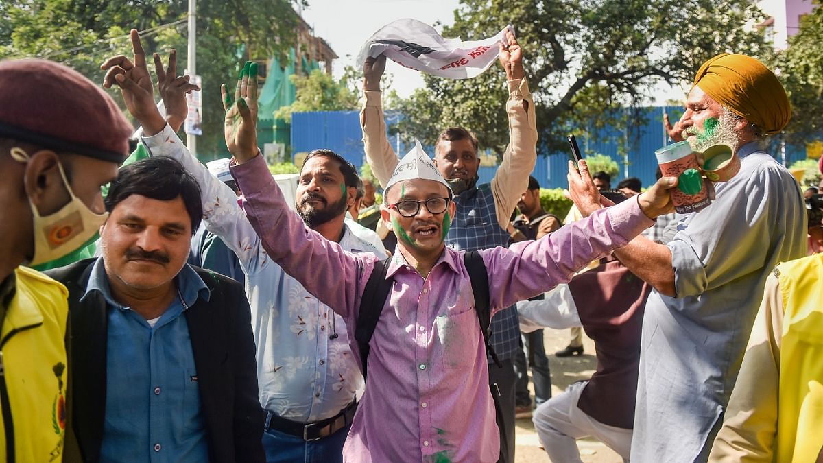 With trends favouring the Bhagwant Mann-led party in Punjab and the party making deep inroads in Punjab, the Aam Aadmi Party workers were seen celebrating the results. Credit: PTI Photo