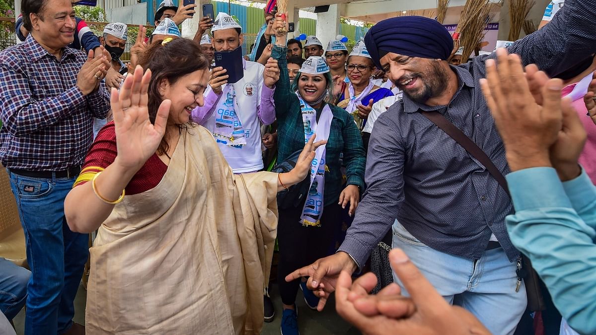 Mumbai's Aam Aadmi Party (AAP) leader Preeti Menon grooves with party workers while celebrating their party's performance in Punjab at the 2022 Assembly Elections. Credit: PTI Photo