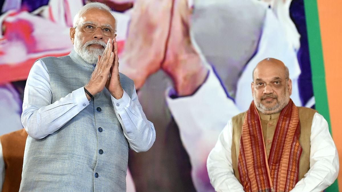 Prime Minister Narendra Modi is seen with Union Home Minister Amit Shah during celebrations at the BJP Headquarters in New Delhi. Credit: PTI Photo