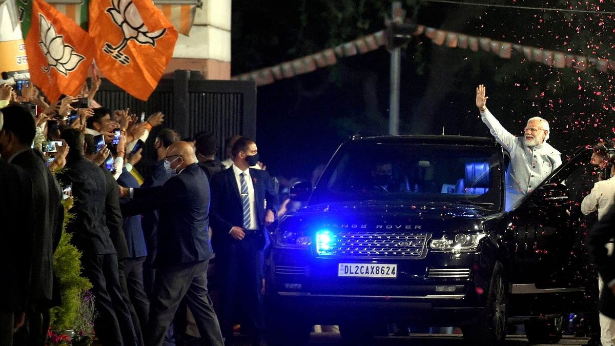 Prime Minister Narendra Modi waves at BJP workers during celebrations at the BJP Headquarters in New Delhi. Credit: PTI Photo