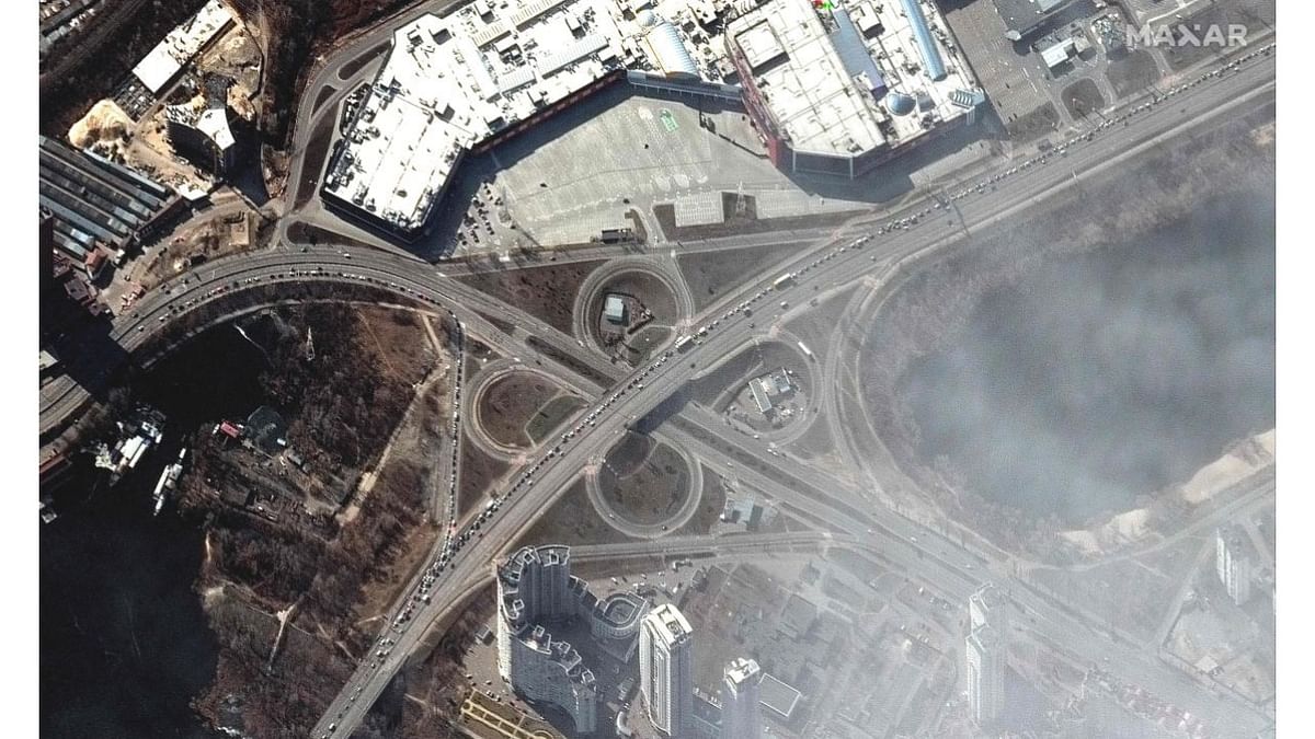 This Maxar satellite image taken and released on March 11, 2022 shows a long line of cars on the highway as residents attempt to leave Kyiv. Credit: AFP Photo/Maxar Technologies