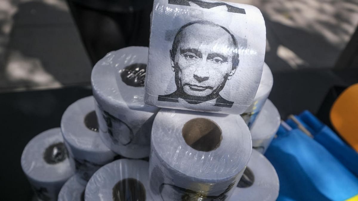 Rolls of toilet paper with an image of Russian President Vladimir Putin are displayed during a rally in support of Ukraine in Santa Monica, California. Credit: AFP Photo