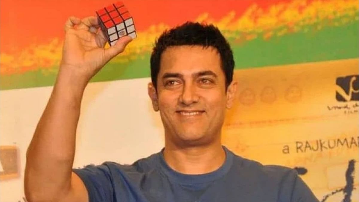 Aamir loves to solve Rubik's cube.  He once solved it in front of a large audience in just 36 seconds. Credit: Twitter/@AKofficialTeam