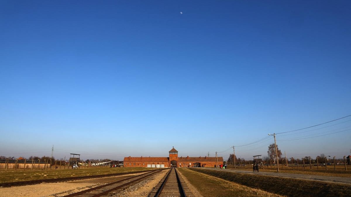 The moon rises over the main railway building on the site of the former Nazi German concentration and extermination camp Auschwitz II-Birkenau, in Brzezinka near Oswiecim. Credit: Reuters photo