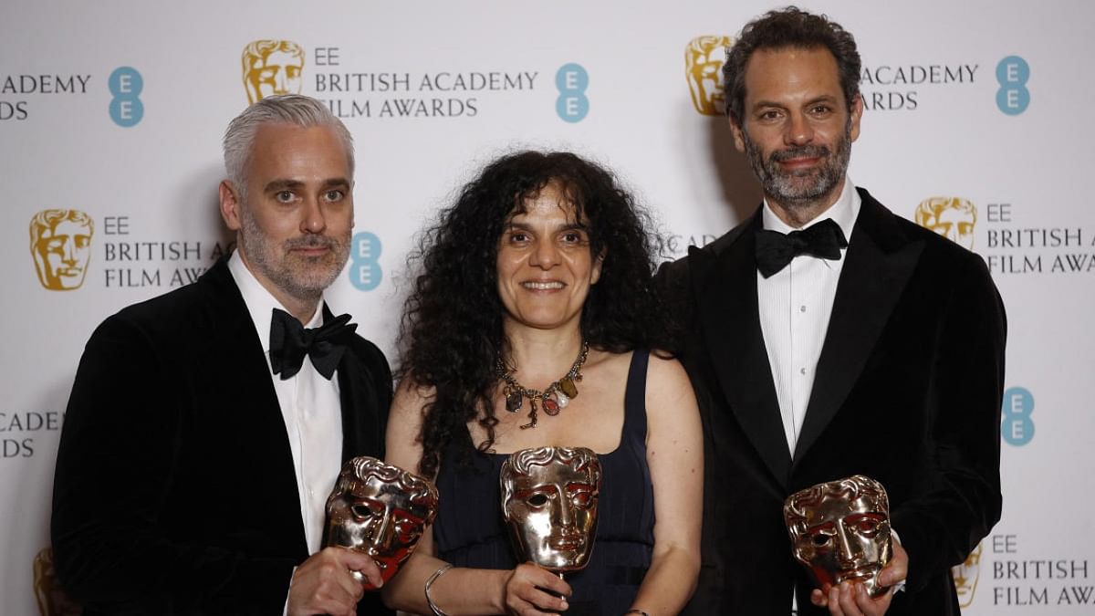 Iain Canning, Tanya Seghatchian and Emile Sherman pose with their award for Best Film for