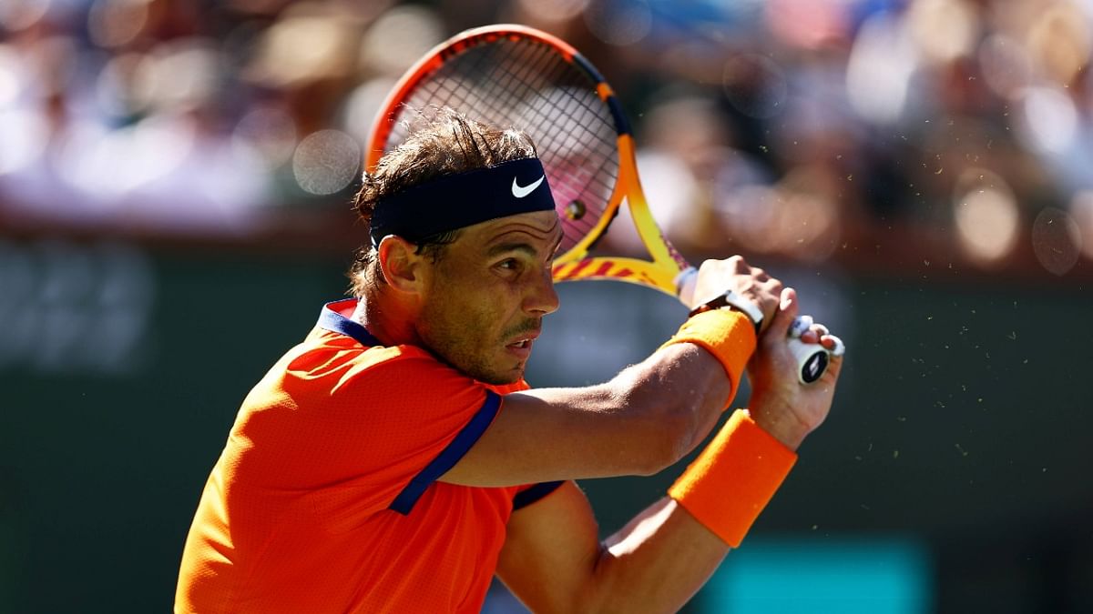 Rafael Nadal of Spain plays a backhand against Dan Evans of Great Britain in their third round match on Day 8 of the BNP Paribas Open at the Indian Wells Tennis Garden. Credit: AFP Photo