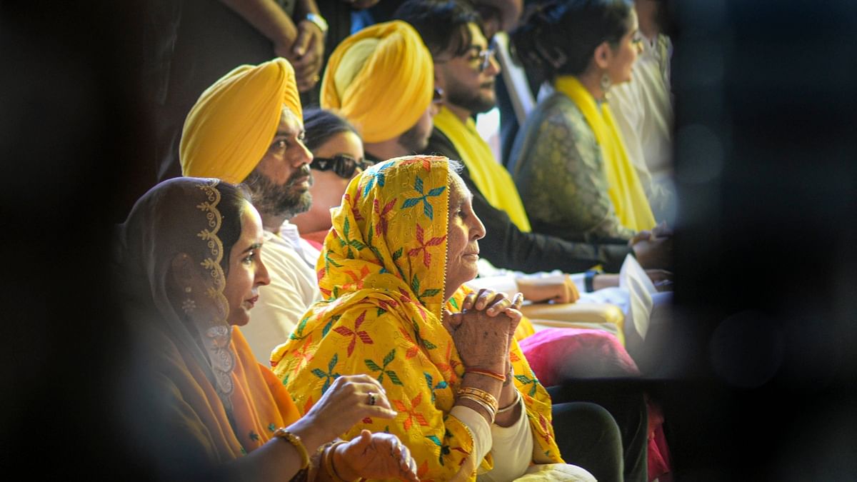AAP leader Bhagwant Mann's mother Harpal Kaur attends his oath-taking ceremony at Khatkar Kalan in Punjab. Credit: PTI Photo