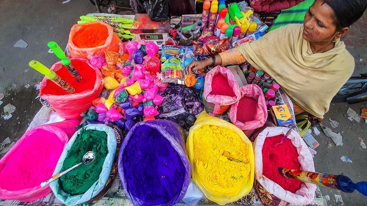 A vendor sells colours and water cannons ahead of the upcoming Holi festival, in Amritsar. Credit: PTI Photo